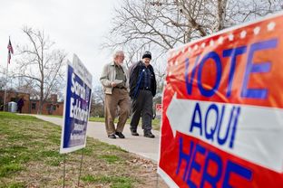 Paul Beckham and Gary Giffen leave Zilker Elementary School in Austin after casting ballots for the primary election on March 4.