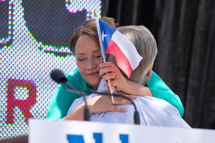 Cecelia Abbott hugs her husband, Attorney General Greg Abbott after he announces his plans to run for governor of Texas during a campaign event at LaVillita in San Antonio.