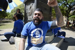 Patrick Fierro and other activists chant during a protest at the University of Texas at Austin on April 9, 2014. They were protesting the Obama administration's record on deportations.