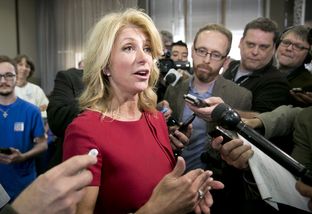 Texas gubernatorial candidate, Sen. Wendy Davis speaks to press following an education rally in Austin, Texas on April 14th