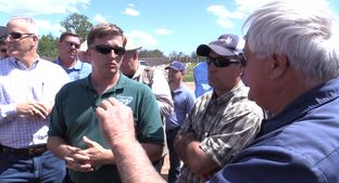Federal Bureau of Land Management spokesman, Paul McGuire, attempts to answer questions from a barrage of property owners in Clay County on Monday.