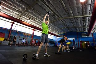 Forensic chemist Rusty White completes a workout during a cross-training class at the DPS office in Austin on May 14, 2014.
