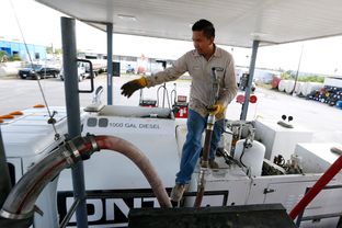Ismael Gonzalez, 22, with DNT Construction filled his tanker truck with dyed diesel fuel at Tex-Con Oil Company on May 20, 2014, in Austin.
