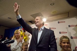 Lt. Gov. David Dewhurst waves after speaking to a crowd on primary election night in Houston.