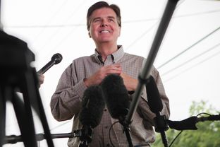 Republican State Sen. Dan Patrick chats with reporters at a polling station in Cypress, Texas Tuesday, May 27, 2014 to stump for votes in his runoff against against incumbent Lt. Gov. David Dewhurst.
