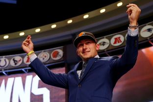 Former A&M quarterback Johnny Manziel recently drafted by the NFL Cleveland Browns was drafted by the San Diego Padres in the 28th round of the Major League Baseball First-Year Player Draft. NEW YORK, NY - MAY 08: Johnny Manziel of the Texas A&M Aggies takes the stage after he was picked #22 overall by the Cleveland Browns during the first round of the 2014 NFL Draft at Radio City Music Hall on May 8, 2014 in New York City.