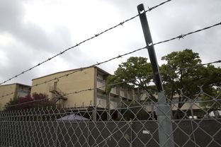 A Guatemalan flag in the window of the Hackney Training Complex at Lackland AFB in San Antonio, Texas where hundreds of minors are currently housed. Texas has seen a dramatic increase in minors crossing the border into the US
