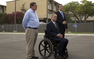 U.S. Rep. Michael Burgess (left), R-Flower Mound, joined Attorney General Greg Abbott and U.S. Sen. Ted Cruz for a news conference on June 23, 2014, after touring a Lackland Air Force Base facility in San Antonio that was serving as a shelter for unaccompanied minors who crossed the border.
