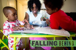 Keshawn Johnson, then 20, colored earlier this year with her sons (l-r) Keenan Mitchell, 20 months, and Kenny Mitchell, 3, in their home in North Dallas.