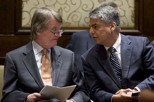 University of Texas President Bill Powers speaks to Provost Gregory Fenves during a board of regents meeting on July 10, 2014.