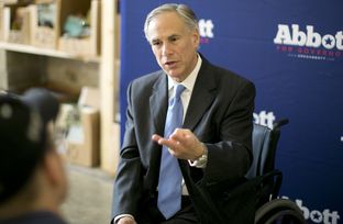 Republican attorney general and gubernatorial candidate Greg Abbott speaks one-on-one with members of the media following his appearance at a Congress Avenue coffeehouse on July 10, 2014.