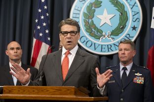 Gov. Rick Perry, flanked by State Rep. Dennis Bonnen, R-Angleton, and Texas Adjutant General John Nichols, announces the deployment of National Guard troops to the Texas border on July 21, 2014.
