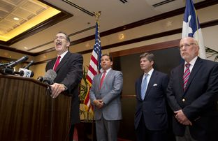 Gov. Perry's legal team, including, l to r, David Botsford, Tony Buzbee, Bobby Birchfield and Ben Ginsberg meet the press on Aug. 18, 2014.