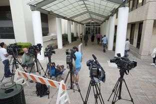 News crews anticipated that Gov. Rick Perry would be processed on Monday, Aug. 18, 2014, at Travis County's Blackwell-Thurman Justice Center. Perry, who was indicted on charges related to his veto of public integrity unit funding, called the indictment without merit and politically motivated.