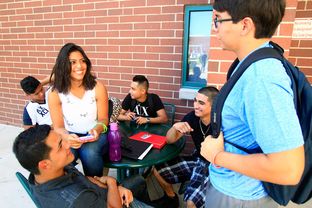 Freshman Samantha Salas (center) hangs out with friends before going to class on the first day of school on Aug. 25, 2014, at South Texas College's Pecan Campus in McAllen.
