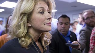State Sen. Wendy Davis speaking to the press after a Travis County Democratic campaign rally on Oct. 22, 2014.