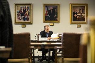 State Board of Education Vice Chair Thomas Ratliff leafs through binders at the meeting listing proposed changes to Texas textbooks in a SBOE meeting in Austin on Monday, October 20, 2014 .Textbook publishers were invited to meeting where public concerns regarding their textbooks were discussed.
