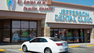A nod to the city's changing demographics, the masthead for a branch of Jefferson Dental Clinics in Irving, Texas includes a large Spanish-language sign on its storefront that reads, “A friend of the Hispanic family.”