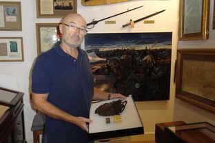 Phil Collins with his collection of Alamo artifacts at his home in Switzerland.