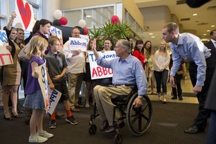 Greg Abbott arrives to a friendly crowd at Signature Aviation on the eve of election day Nov. 3, 2014.