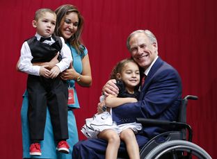 Republican Greg Abbott celebrates with family after winning governor's race in a landslide.