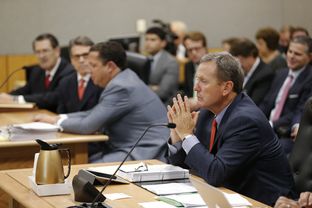 Prosecutor Michael McCrum gathers his thoughts as testimony continues in Travis County District Court on the Gov. Rick Perry case on Nov. 6, 2014.