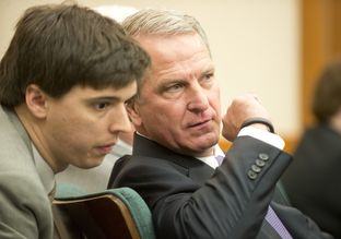 Health and Human Services Executive Commissioner Kyle Janek whispers to an aide at a hearing of the Sunset Advisory Commission on Jan. 14, 2015.