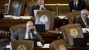 State Rep. Chris Turner, left, on the House floor during a budget debate on March 31, 2015.