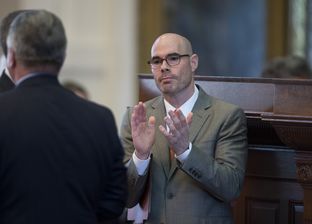 State Rep. Dennis Bonnen, R-Angleton, celebrates passage of his tax cut measures during the House session April 28, 2015.