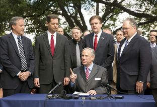 Gov. Greg Abbott signs SB #2065 into law on June 11, 2015 joined by Attorney General Ken Paxton, Lt. Gov. Dan Patrick and authors of the bill Sen. Craig Estes R-Wichita Falls and Rep. Scott Sanford R-McKinney