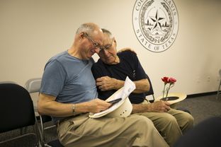 Jeff Sralla, left, with his partner of 28 years, Gerard Gafford, at the Travis County Clerk's office, where they applied for a marriage license after the Supreme Court legalized same-sex marriage nationwide on June 26, 2015. Travis County began issuing marriage licenses to same-sex couples immediately after the ruling, but other counties did not.
