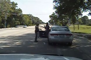 Screenshot from Department of Public Safety dash cam video shows Sandra Bland as she exits her car after DPS officer Brian Encinia has drawn his taser on July 10, 2015.