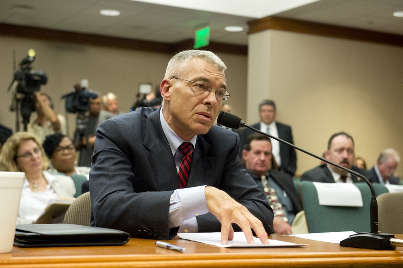 Texas DPS Director Steve McCraw speaks to State Rep. Garnet Coleman, chair of the House Committee on County Affairs during a hearing on July 30, 2015