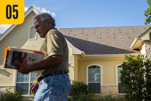 Nipendra Patel in front of his home in the Bastrop community of The Colony. Patel's roof is marked with studs meant to support solar panels, but the neighborhood's developer blocked their installation.