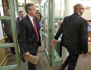 Texas Attorney General Ken Paxton arrives at court in Fort Worth to plead not guilty to felony charges.