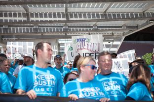 Austin Uber drivers participate in a September rally against a proposal by the Austin Transportation Department to set regulations similar to those for traditional taxi drivers such as fingerprint-based background checks. The Austin City Council passed the proposal in December, and Uber and Lyft threatened to pull out of the city.