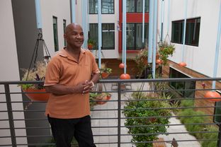Dalton Duffie, an outreach coordinator at Capital Studios, an affordable housing site in downtown Austin, was homeless before he got a subsidized apartment.