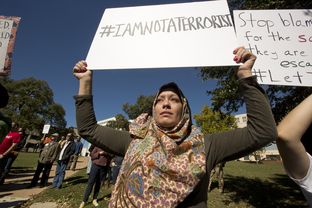 Houston resident Jazmine Myluhu attends a rally to protest Gov. Abbott's decision on Syrian refugees, organized by The Syrian People Solidarity Group. Nov. 22, 2015.