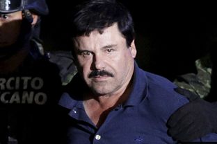 Captured fugitive drug cartel leader Joaquin "El Chapo" Guzman is escorted by police in Mexico City on Jan. 8, 2016.
