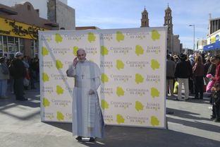 A cardboard cutout of His Holiness Pope Francis greets residents of Ciudad Juárez on January 16, 2016. Pope Francis will visit the border city in February as part of a six-day tour of Mexico.