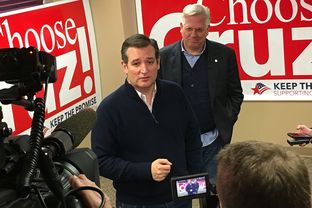 Ted Cruz speaks with reporters Saturday in Ankeny, Iowa, after receiving the endorsement of conservative radio host Glenn Beck. The Republican presidential candidate visited Ankeny to launch his final tour of Iowa before its Feb. 1 caucuses.