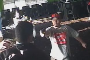 Obed Josafhat Rodriguez is pictured waving a gun on surveillance video taken from the Monroe Game Room in Houston on Aug. 30, 2013. He and an accomplice were convicted in shooting death of Yolanda Lara, a game room employee.
