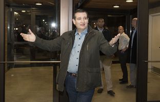 U.S. Sen. Ted Cruz enters the State Fairgrounds building in Des Moines on Jan. 31, 2016, the evening before the Iowa caucuses.