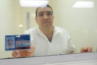 Juan Leonardo Quintero, an undocumented immigrant pictured here in 2015 in a visitation booth at the maximum-security Allred Unit near Wichita Falls, is serving a life sentence for the 2006 murder of Houston Police Officer Rodney Johnson.