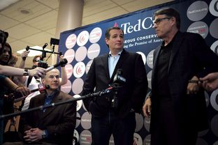 Ted Cruz, flanked by Gov. Greg Abbott and former Governor Rick Perry, campaigns in San Antonio a day ahead of Super Tuesday, Feb 29, 2016.
