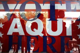 People stand in line to vote for the primaries at the Flawn Academic Center on the University of Texas campus on March 1, 2016.