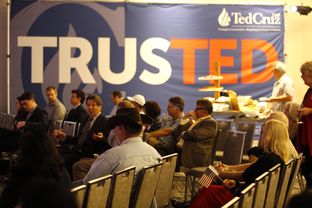 Supporters of Ted Cruz watch as results come in at his election night party Tuesday in Houston. Five states are holding their presidential nominating contests Tuesday.