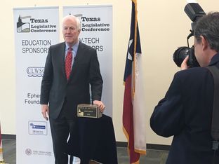 U.S. Sen. John Cornyn, R-Texas, with the "Texan of the Year" award at the Texas Legislative Conference in New Braunfels on March 18, 2016.