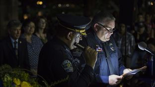 Austin Police Association President Ken Casaday reads a speech during an evening vigil to honor five slain Dallas police officers at the state Capitol on July 14, 2016.
