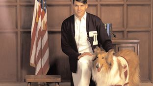 Rick Perry with Reveille, the Texas A&M mascot. This image is included in Perry's collection in the Texas Digital Archive.
